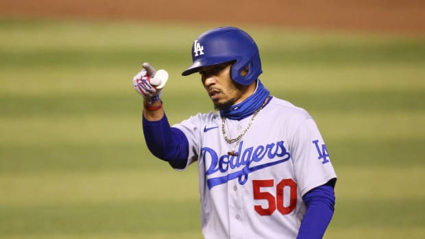Sep 8, 2020; Phoenix, AZ, USA; Los Angeles Dodgers Mookie Betts (50) reacts after hitting an RBI-single against the Arizona Diamondbacks in the seventh inning at Chase Field. Mandatory Credit: Rob Schumacher/The Arizona Republic via USA TODAY NETWORK Mlb Los Angeles Dodgers At Arizona Diamondbacks